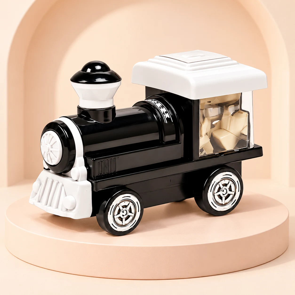 Golden Toys black and white Thar train engine on a peach studio display stand